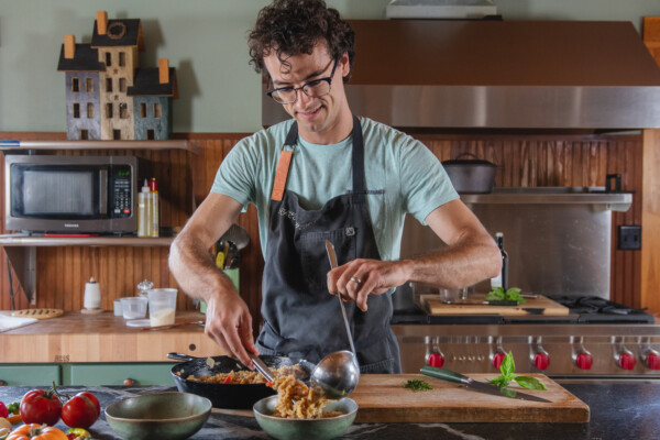 Giacomo Vascotto of Trenchers Farmhouse prepares a pasta dish in Lyndonville. “Our goal is to be an exceptional brand with a superior product, bigger mouth feel, creamier texture, and bigger flavor” he says. Photo by Erica Houskeeper.