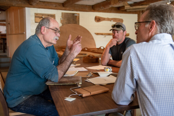 Scott Duffy, left meets with VSJF business coach Steve Voigt and Ian Duffy. One of the things business coaches have helped with is long-term planning. Photo by Erica Houskeeper.